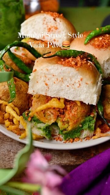 Vada Pav ❤️ The king of Mumbai street food! 🇮🇳
.
Crispy, spicy potato vada tucked inside a soft pav, layered with fiery red garlic chutney and served with a fried green chili on the side. Every bite is packed with bold flavors! As a true Mumbaikar, this has always been my all time favorite snack, whether it’s breakfast, tea time, or a quick evening bite.

✨ Crispy outside
🥔 Soft and flavorful inside
🌶️ Spicy, garlicky, and absolutely irresistible!

Comment “Vada Pav” and I’ll send the full recipe straight to your inbox! ❤️
.
.
.
.
Save this reel for later, share it with your fellow street food lovers, and don’t forget to follow @binjalsvegkitchen for more authentic Indian vegetarian recipes!
.
,
.
#vadapav #mumbaistreetfood #mumbaifood #mumbaifoodlovers #indianfood