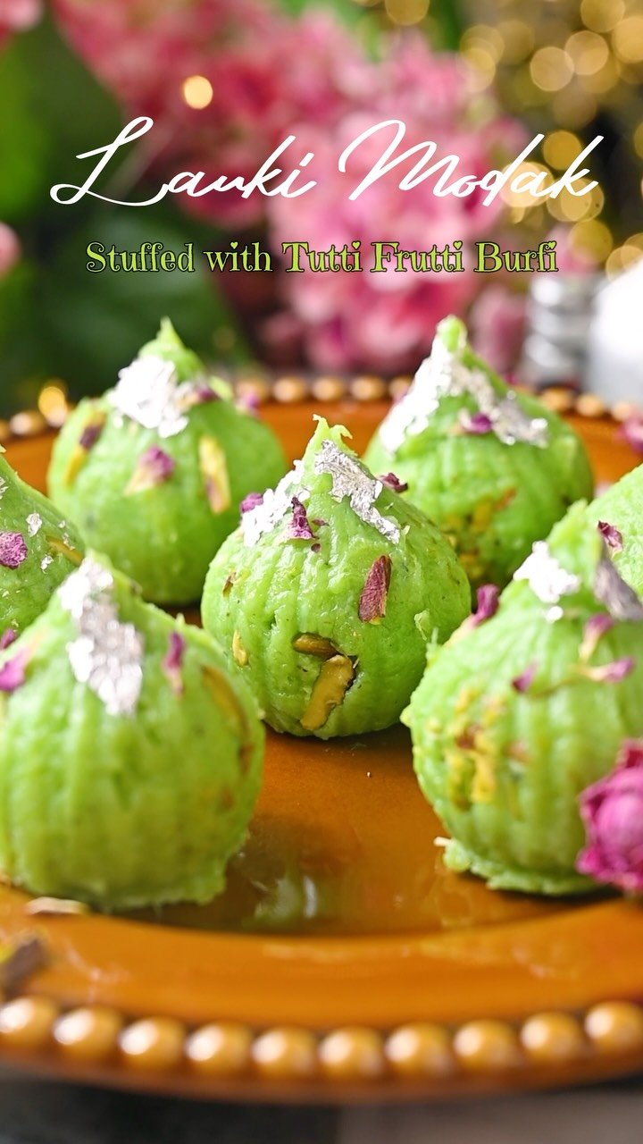Lauki Modak Stuffed with Tutti Frutti Burfi 💚✨

Have you ever made Modak with Lauki? 😍

I know it sounds a little different, but trust me, these turned out SO good! The Lauki mixture is soft, creamy and mildly sweet, and then you get that little surprise of Tutti Frutti Burfi with nuts in the center. 😋

I shaped them in a Modak mold, added some chopped Pistachios and finished them with silver leaf, nuts and dried rose petals. They look so pretty on a festive platter! ✨

If you are looking for a different Modak recipe this Ganesh Chaturthi, definitely give this one a try. ❤️
.
Comment MODAK and I’ll send you the recipe in DM 📩
.
Follow @binjalsvegkitchen for more vegetarian recipes and festive sweets! 💚
.
Ganpati Bappa Morya ⚜️🪷