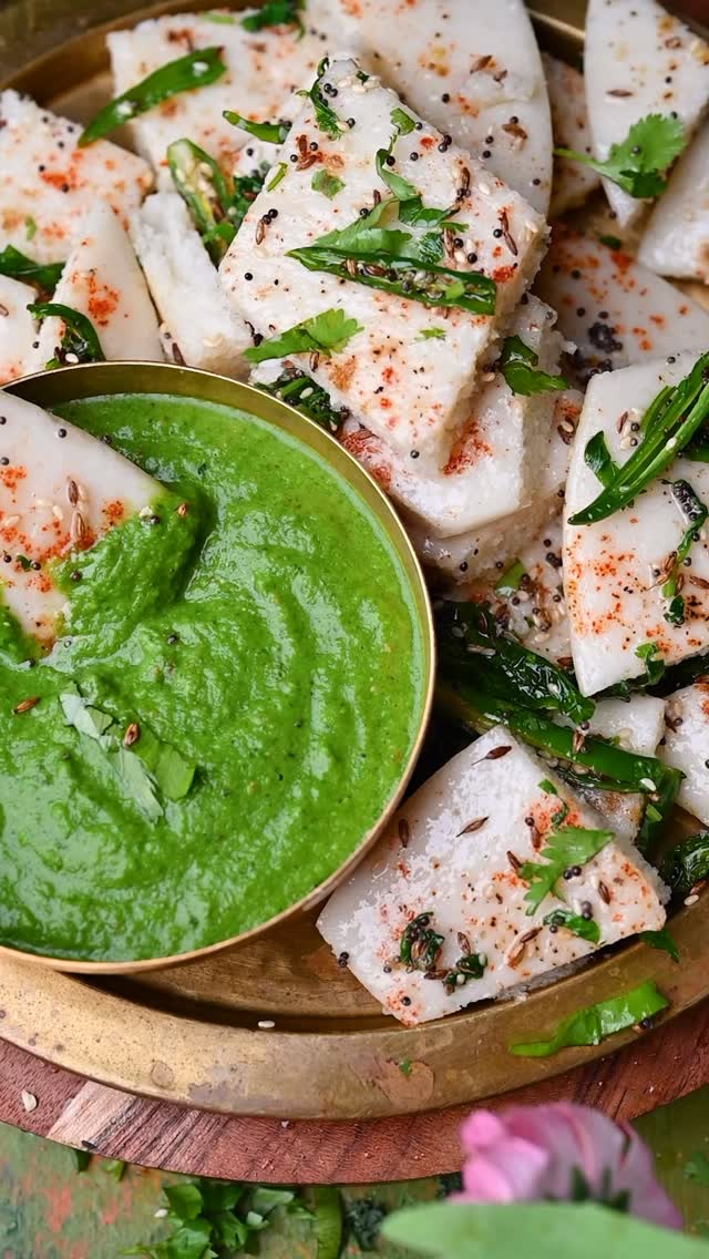 Khatta Dhokla also called Idada, Idra , Idla or White Dhokla. It is a vegetarian snack item that originates from Gujarat. It can be eaten for breakfast or as a snack. It is made with a fermented batter derived from rice, Urad dal and chana dal. This Dhokla called as “Khatta Dhokla” because of its sour taste. In Gujarati, sour means “Khatta”. And we can get this sour taste by adding a sour curd. Typically, in Gujarat this Dhokla serves with Gujarati Thali as a Farsan.
.
Comment “ DHOKLA “ I’ll send detailed recipe to your inbox!
.
.
.
.
.
.
.
.