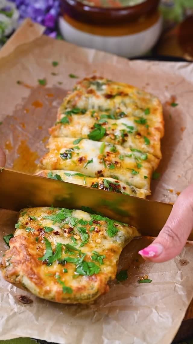 This cheesy garlic bread with chili basil oil is a showstopper that works as an appetizer, snack, or party pleaser. The buttery garlic paste, melted cheese, and spicy basil oil create a harmony of flavors that will leave everyone asking for seconds. Easy to customize and simple to prepare, this recipe promises to become a household favorite. Try it out and share the joy of cooking with those you love!

.
Comment “ Cheesy “ I’ll share recipe in your inbox!
.
.
.
.
.